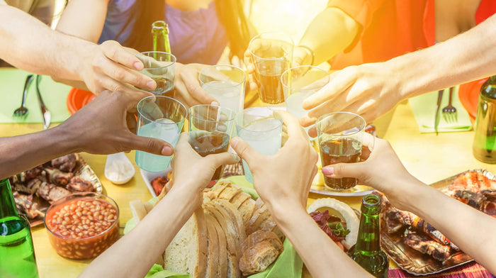 friends cheer with beers and glass drinks